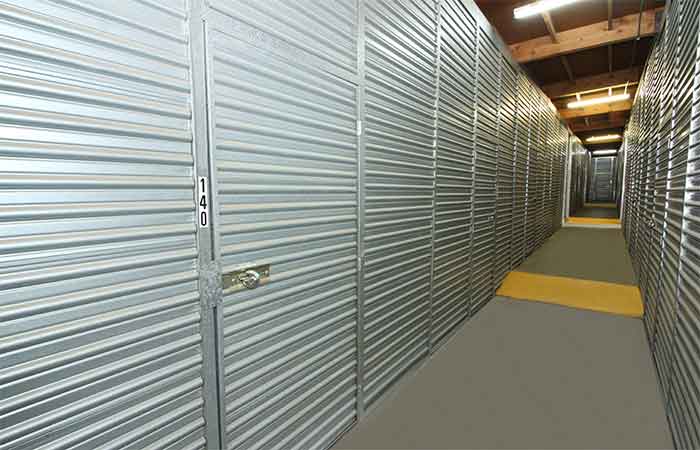 Indoor storage units with swing doors.