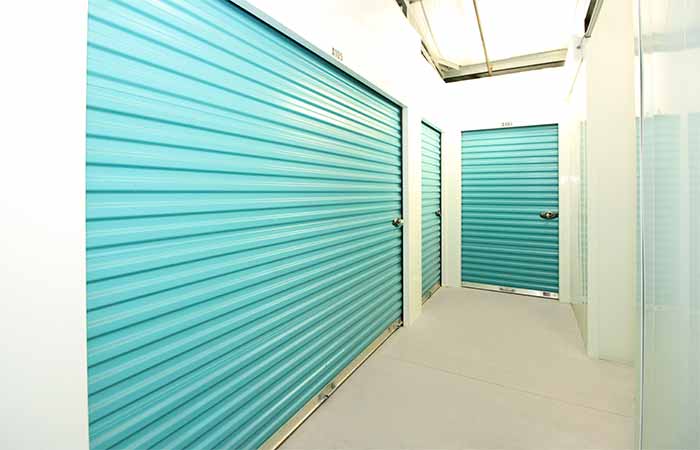 Large indoor storage units with roll-up doors.