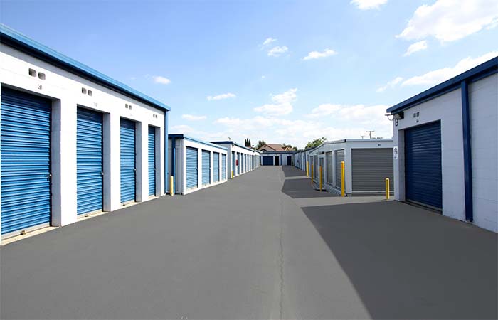 Drive-up storage units in a wide aisle for easy access.