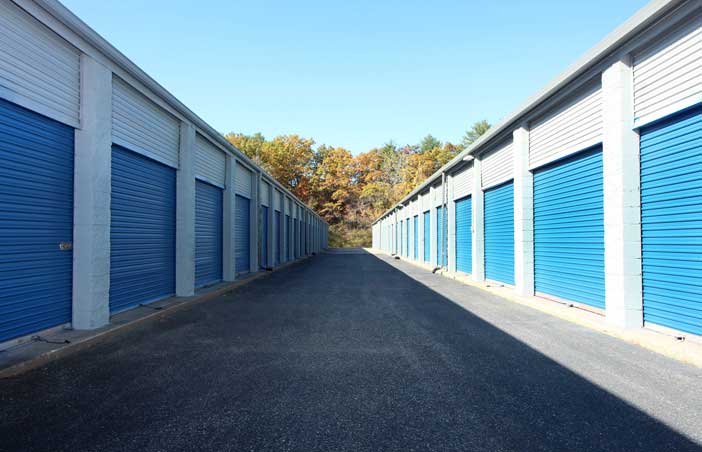 Drive-up storage units in a wide aisle for easy access.